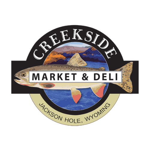 Logo of Creekside Market & Deli with a fish illustration and mountain background
